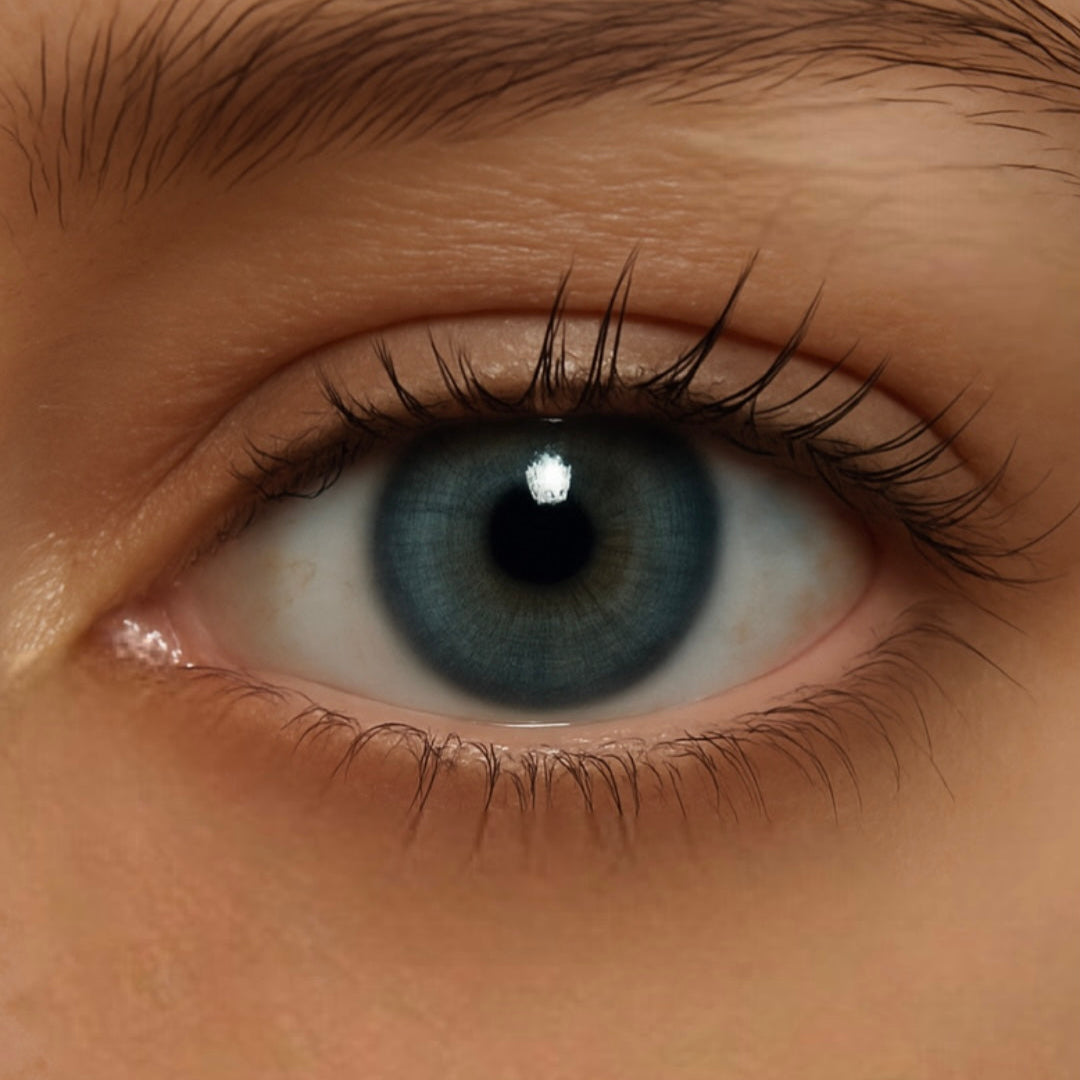 Close-up of Blue Mountain lenses enhancing eyes with layered light and dark blue tones